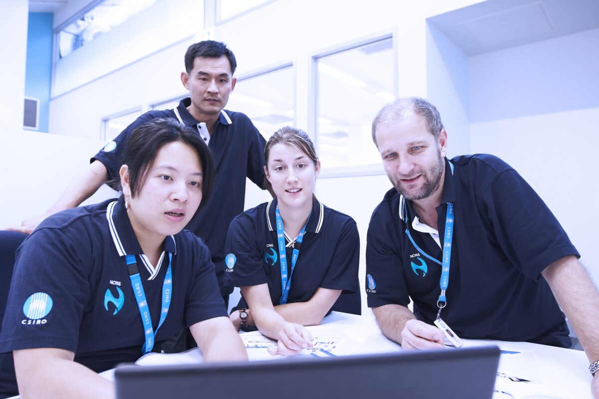 Researchers working in a recombinant protein production laboratory